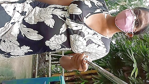 A brunette walks in the park in the nude and is caught